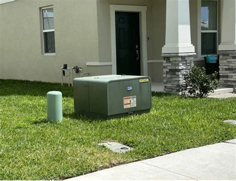 green electric box at fence|green pack electrical system.